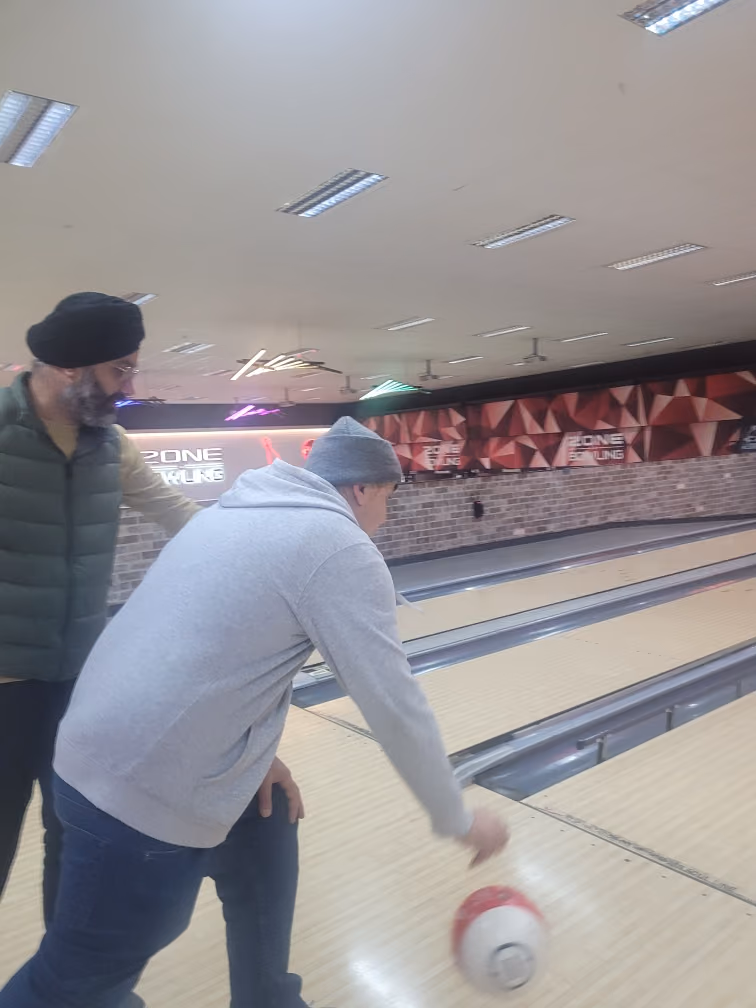 Participants bowling together at the local alley.