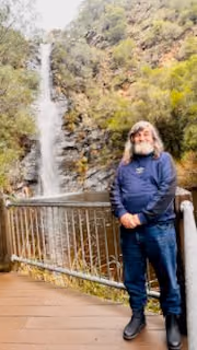 A participant visiting a waterfall in the Adelaide Hills.