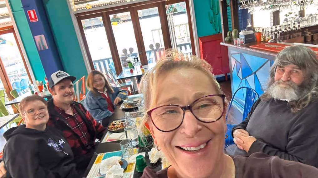 A group sharing a meal out together at a restaurant.