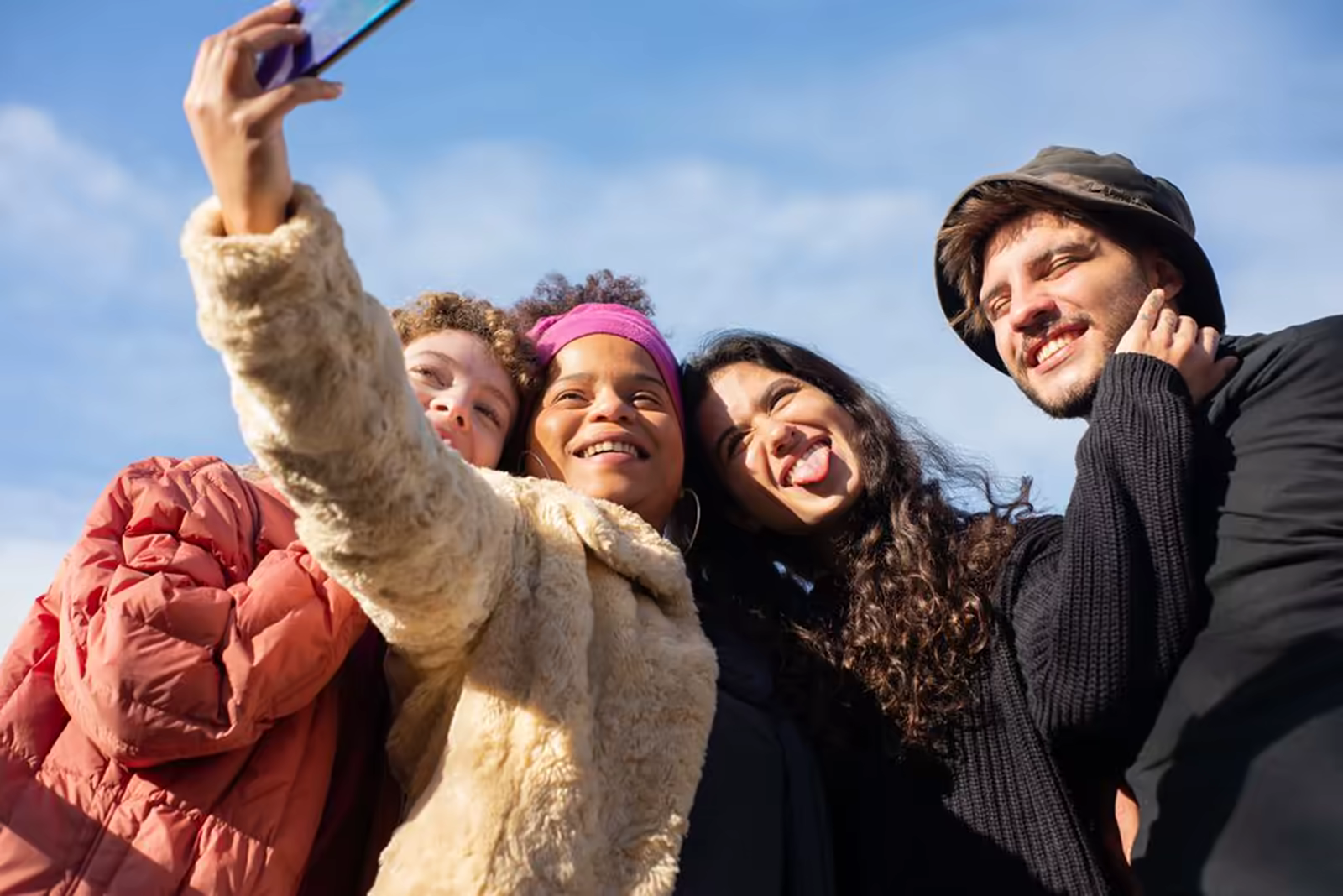 A support worker and participants enjoying an outdoor group excursion together